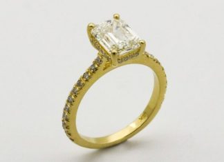 How to Choose the Perfect Yellow Gold Engagement Ring gold ring on white surface