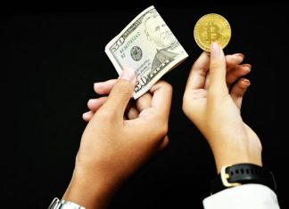 How to convert XMR to USDT? person holding 20 us dollar bill