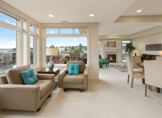 Why Home Prices Continue to Rise Despite Interest Rate Hikes beige couch and armchair