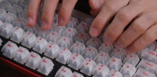 A close up of a person typing on a keyboard