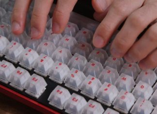 A close up of a person typing on a keyboard