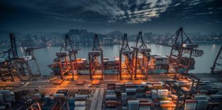 red and black cargo ship on dock during daytime