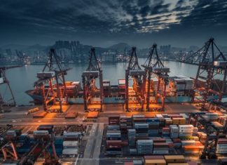 red and black cargo ship on dock during daytime
