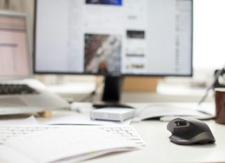 Boosting Business Efficiency With Smart Digital Solutions black flat screen computer monitor and gray wireless mouse