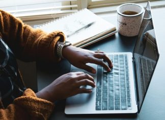 person using black and silver laptop computer