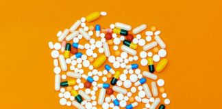 white and orange medication pill