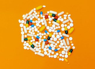 Birth Control Pills: Myths vs. Facts white and orange medication pill