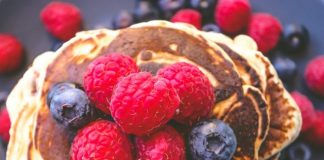 brown pie with red and blue berries