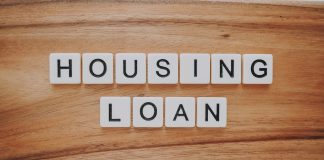 housing loan blocks on brown wooden surface