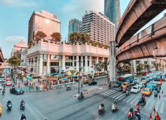 cars parked on side of the road near buildings during daytime