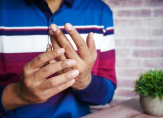 The Advantages of Early Intervention in Chronic Pain Conditions person in blue and white long sleeve shirt