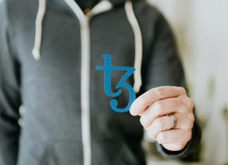 Decrypting Provably Fair Technology: Learn How Crypto Casinos Keep Games Fair a man in a black hoodie is holding a blue sticker