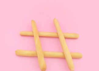 The Smartest Ways to Use Content Marketing to Nurture and Convert Leads four brown wooden sticks on pink surface