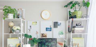 turned on flat screen monitor white wooden desk
