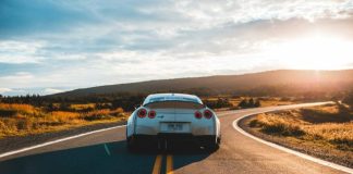 silver sports coupe on asphalt road