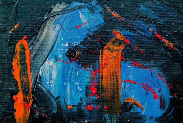 Photo by Steve Johnson blue, black, and orange abstract painting