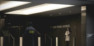 security guard standing on the gray floor