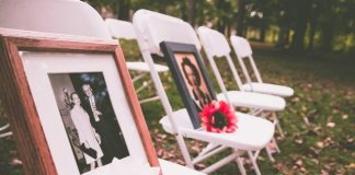 brown wooden photo frame on white folding chairs