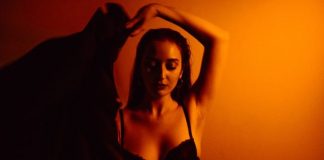 a woman in a bra posing for a picture