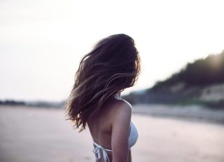 Hair Growth Products: What to Expect and How to Maximize Results woman standing wearing white bra in selective focus photography