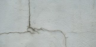 a crack in the side of a white wall