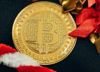 How to Secure Crypto-Backed Loans Without Selling Your Assets? a golden bitcoin sitting on top of a black table