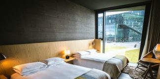 a couple of beds in a room