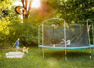 Air Time Adventures for Kids (and Grown-Ups Too) two children playing on a trampoline in a yard
