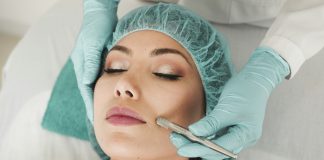 woman doing liposuction on her face