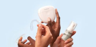 a group of people holding a white object in their hands