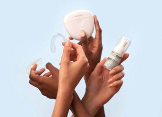 This Is What Dental Hygienists Look For in a Whitening Machine a group of people holding a white object in their hands