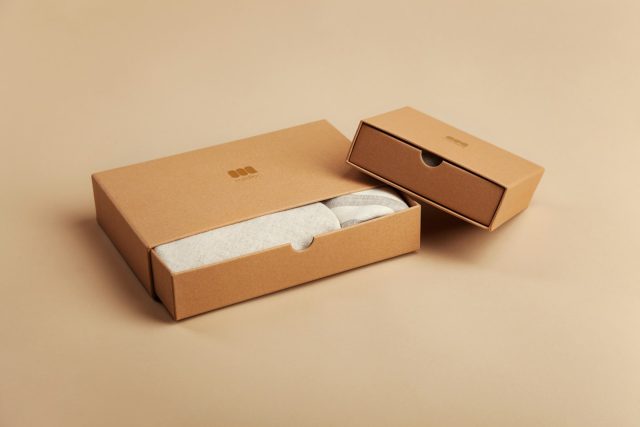 Photo by Mildlee brown cardboard box on white table