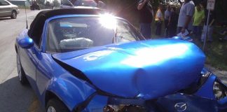 A blue car with a damaged front end AI-generated content may be incorrect.