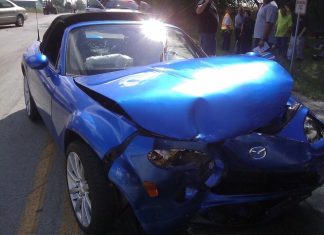 How Long is the Legal Process of a Car Accident? A blue car with a damaged front end AI-generated content may be incorrect.