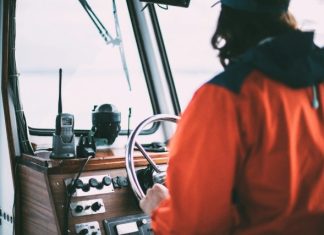 Best Walkie-Talkie for Remote Workers and On-the-Go Teams person holding steering wheel inside vehicle during daytime