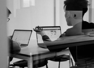 B2B Sales Are Slower When Buyer Visibility Is Low man using MacBook