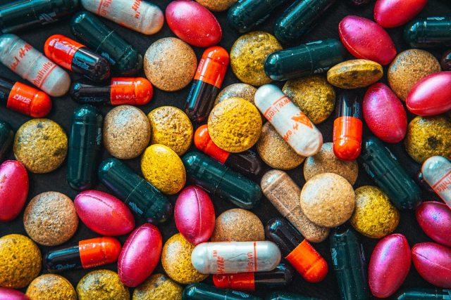 Photo by Raimond Klavins red and brown medication pill