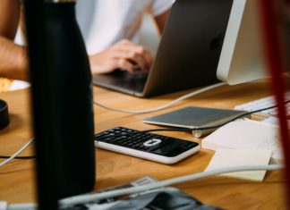 person using silver MacBook