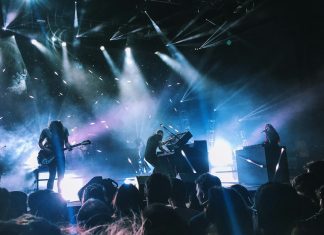 Physical Entertainment in the Digital Age: How Technology Transforms Local Industries music band playing on stage