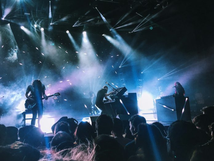Photo by Matthew Kalapuch music band playing on stage