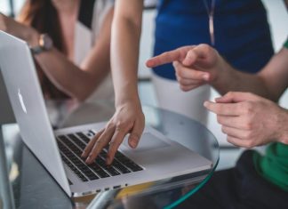 What Is Multi DRM? A Beginner’s Guide to Cross-Platform Content Protection person touching and pointing MacBook Pro