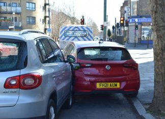 Skilled Baltimore Car Accident Lawyers Fighting for Your Rights a red car is parked next to a silver car