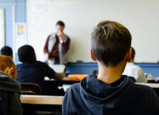Why Your Class Schedule Isn’t the Only Thing You Should Plan Weekly boy in black hoodie sitting on chair