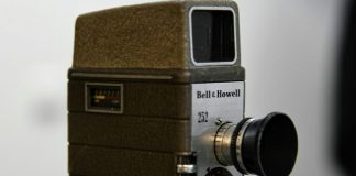 an old camera sitting on top of a table
