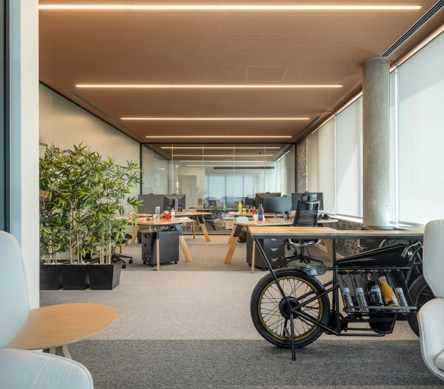 Photo by PHC Software an office with a bike parked in the middle of the room
