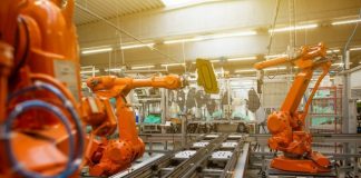 a factory filled with lots of orange machines