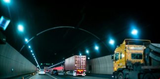 yellow truck on road during nighttime
