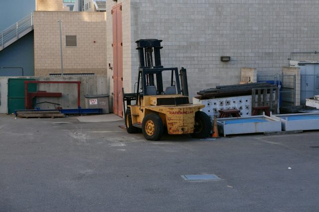 Photo by Carlos Gonzalez a forklift in a warehouse