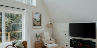a living room filled with furniture and a flat screen tv