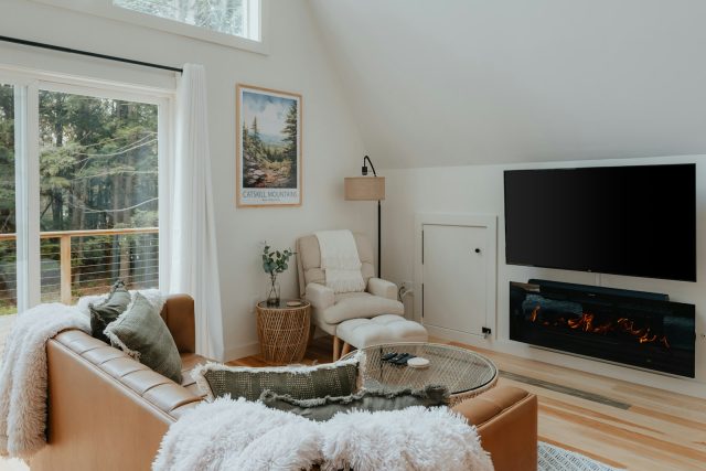 Photo by Clay Banks a living room filled with furniture and a flat screen tv